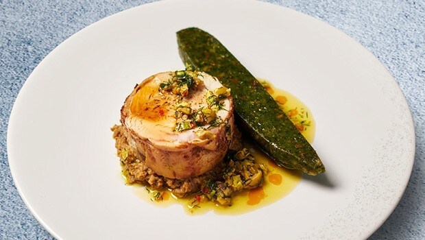 Plant-based dish made of Sprouted Chickpeas, Socca pancake, kale and BBQ Maitake mushrooms 