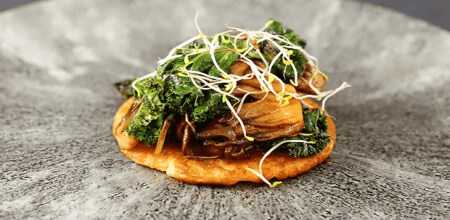 Dish made from roast, boned and rolled chicken, smoked aubergine and green olive dressing