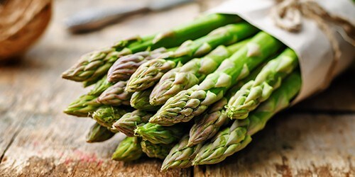asparagus on a dark wood background. the toning. selective focus