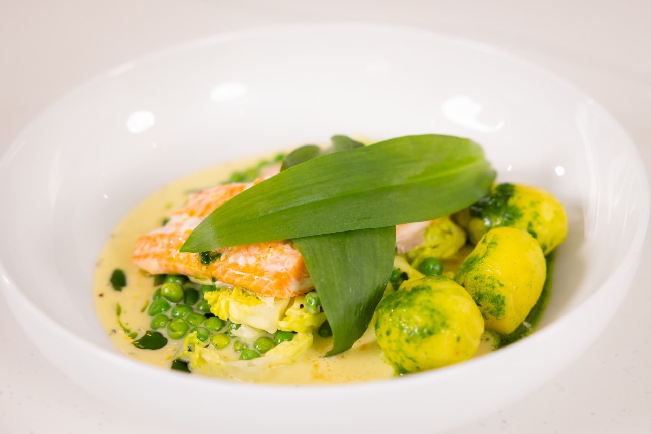 Baked Goatsbridge Seatrout with Peas, Lettuce and Wild Garlic Potatoes. 
