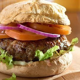 Beef burger in a gluten free bread roll Beef burger in a gluten free bread roll