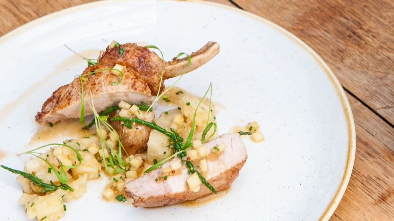 Slow roast pork chop with celeriac and apple by Larry Jayasekara